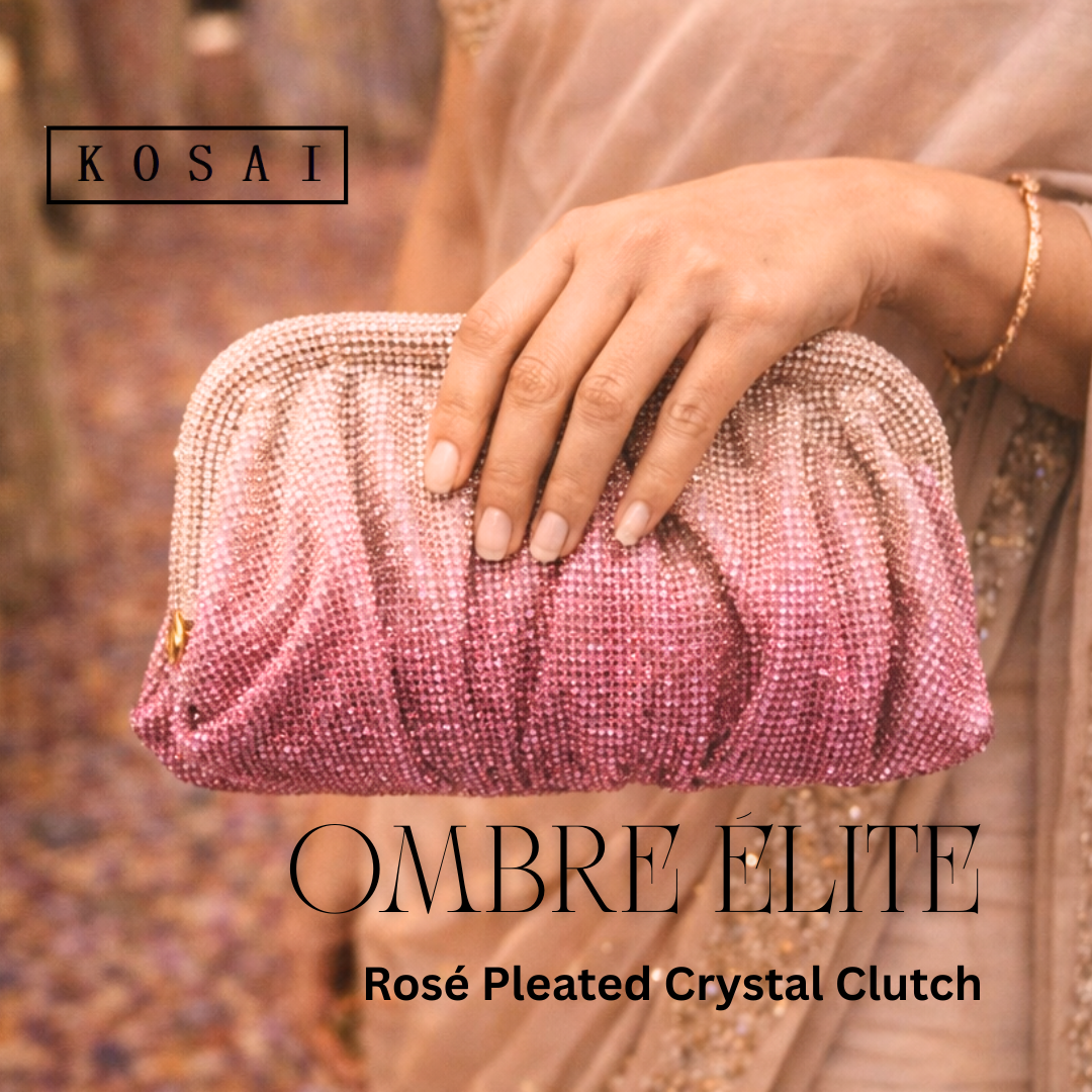 Hand holding a rose gold pleated crystal clutch with 'KOSAI' branding.